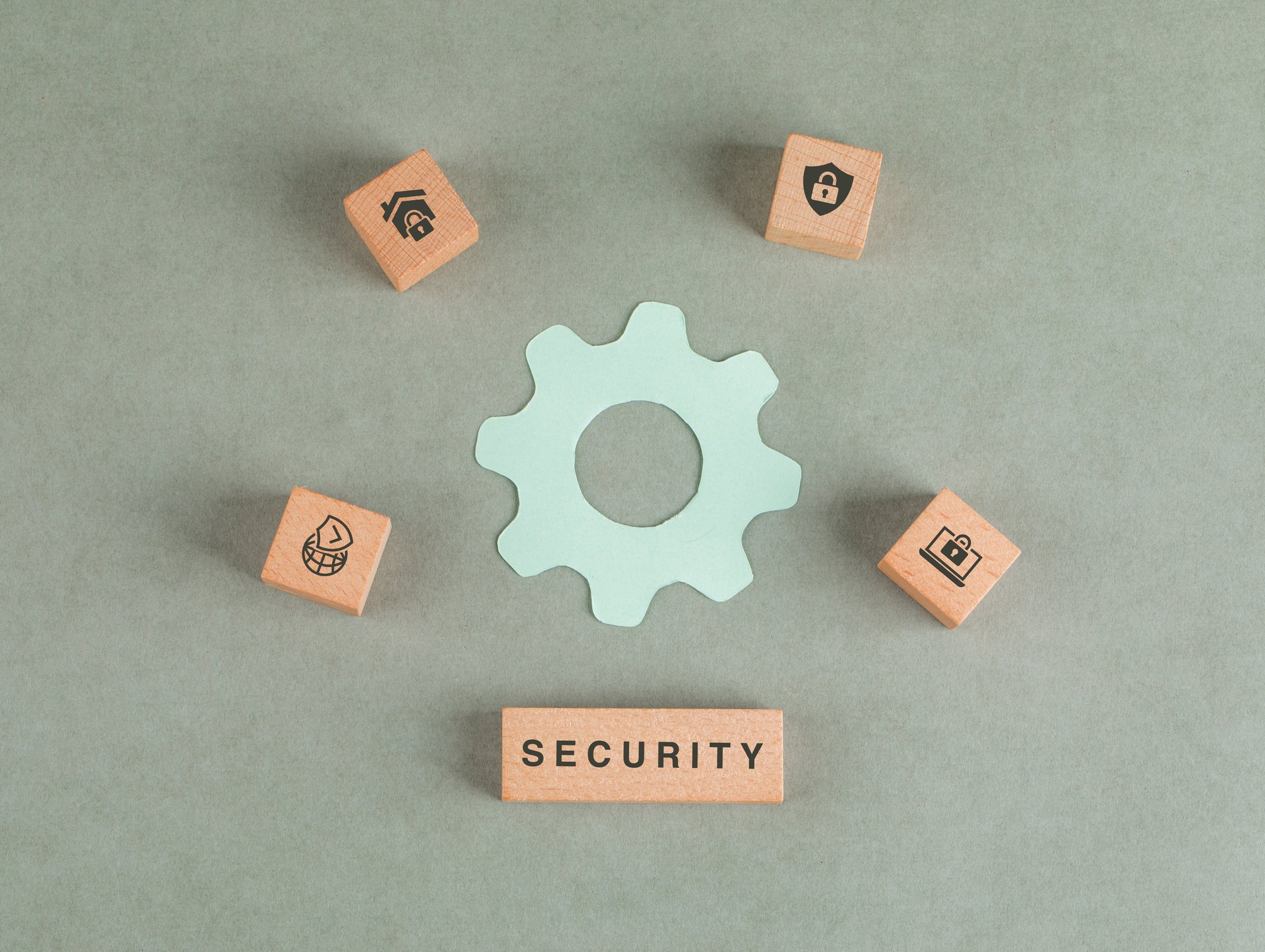 conceptual-security-with-wooden-blocks-paper-settings-icon